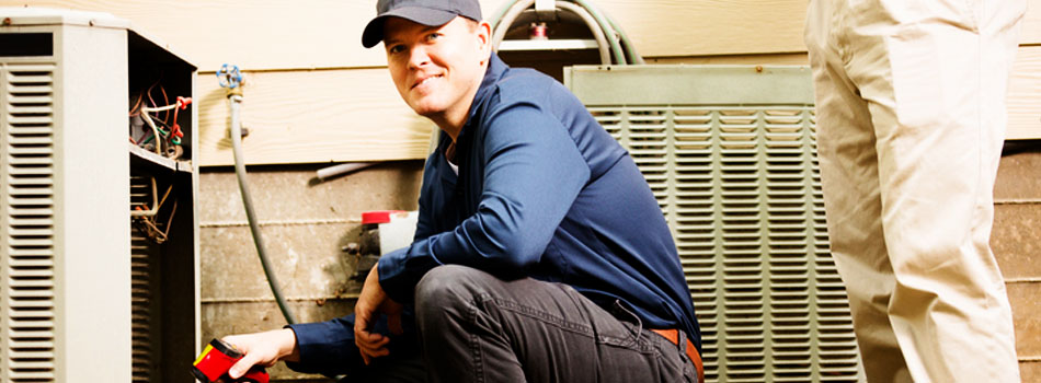 HVAC technician installing unit.