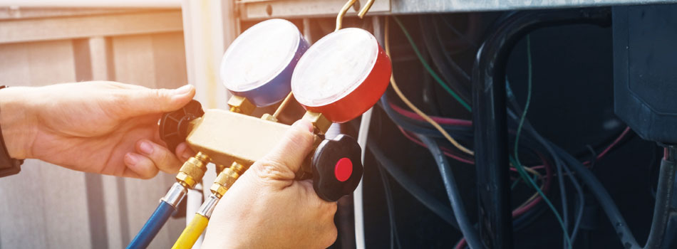 Technician repairing HVAC unit.