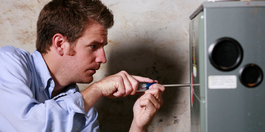 Service technician removing heater's shell